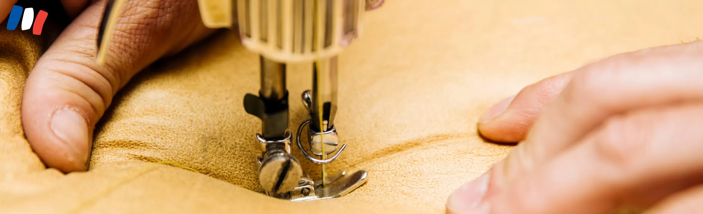 Détail du travail de couture à l'atelier de fabrication